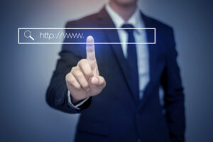 business man clicking internet search page on computer touch screen